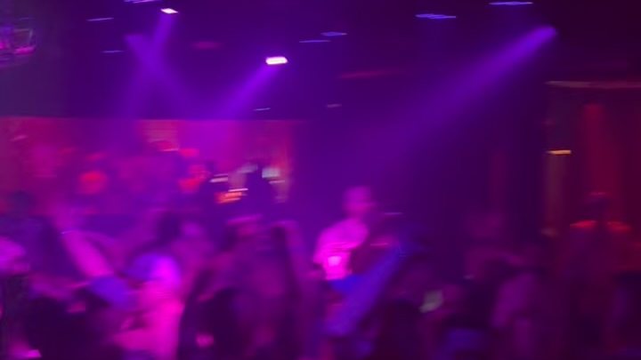 Purple lights over a busy dance floor at the Heretic