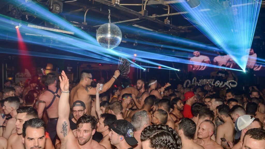A packed dance floor under the disco ball and lasers at the Heretic in Atlanta